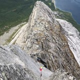 Barbara climbs the offwidth crack of the Vesteggen
