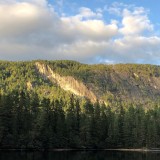 Climbing area Urdiviki with lake and floodgate in the foreground