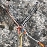 Typical belay using rock tunnel and piton (Photo: Caro)