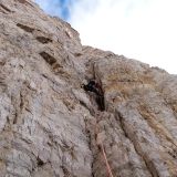 Sigi climbing the first dihedral of the route Gelbe Kante