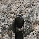 Sigi on a jammed rock which is passed underneath