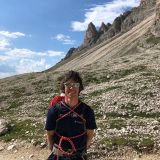 Sigi on the trail with the scree field in the background