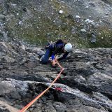Barbara climbing along a flake